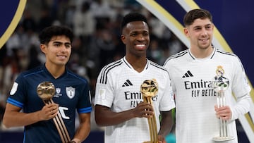 Real Madrid's Brazilian forward #7 Vinicius Junior (C), Uruguayan midfielder #8 Federico Valverde (R), and Pachuca's Mexican midfielder #28 Elias Montiel (L) pose with their gold, silver, and bronze trophies during the podium ceremony after the 2024 FIFA Intercontinental Cup final football match between Spain's Real Madrid and Mexico's Pachuca at the Lusail Stadium in Doha on December 18, 2024. (Photo by KARIM JAAFAR / AFP)