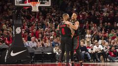 Mar 9, 2019; Portland, OR, USA; Portland Trail Blazers guard Damian Lillard (0) and guard CJ McCollum (3) embrace during the second half against the Phoenix Suns at Moda Center. The Trail Blazers beat the Suns 127-120. Mandatory Credit: Troy Wayrynen-USA TODAY Sports