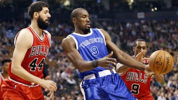 Mar 21, 2017; Toronto, Ontario, CAN; Toronto Raptors forward Serge Ibaka (9) tries to control the ball as Chicago Bulls forward Nikola Mirotic (44) and Chicago Bulls guard Rajon Rondo (9) defend during the first half at the Air Canada Centre. Mandatory Credit: John E. Sokolowski-USA TODAY Sports