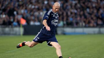 Former French national team and Girondins de Bordeaux football player Zinedine Zidane controls the ball as he takes part in the exhibition soccer match celebrating the centenary of the Chaban-Delmas stadium in Bordeaux, south-western France, on May 14, 2024. (Photo by ROMAIN PERROCHEAU / AFP)