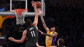Nov 15, 2016; Los Angeles, CA, USA; Los Angeles Lakers forward Brandon Ingram (14) is defended by Brooklyn Nets center Brook Lopez (11) and guard Bojan Bogdanovic (44) during a NBA basketball game at Staples Center. The Lakers defeated the Nets 125-118. Mandatory Credit: Kirby Lee-USA TODAY Sports