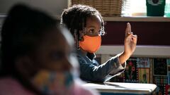A masked first grader attends class at Stark Elementary School on September 16, 2020 in Stamford, Connecticut. 