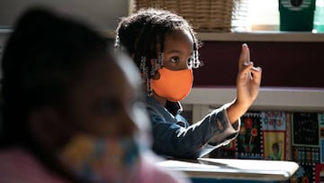 A masked first grader attends class at Stark Elementary School on September 16, 2020 in Stamford, Connecticut. 