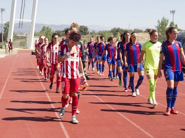 Barcelona Femení and Atlético Madrid Femenino stride out for today's Copa de la Reina final in Las Rozas.