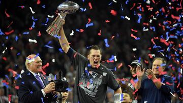 (FILES) This file photo taken on February 5, 2017 shows Tom Brady #12 of the New England Patriots holds the Vince Lombardi Trophy as Head coach Bill Belichick (R) looks on  after defeating the Atlanta Falcons 34-28 in overtime during Super Bowl 51 at NRG Stadium in Houston, Texas.
 A joint probe by the NFL and the NFL Players Association found no evidence Tom Brady suffered a concussion during the 2016 season, a statement said on September 6, 2017. A review of Brady&#039;s medical records by the league and player&#039;s union conducted with the quarterback&#039;s blessing uncovered no sign of concussion.  Brady also did not report or show any symptoms of concussion.The probe was carried out after Brady&#039;s wife, Gisele Bundchen, told CBS television earlier this year that the New England Patriots star had suffered multiple concussions over the years. 
  / AFP PHOTO / Timothy A. CLARY