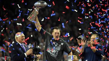 (FILES) This file photo taken on February 5, 2017 shows Tom Brady #12 of the New England Patriots holds the Vince Lombardi Trophy as Head coach Bill Belichick (R) looks on after defeating the Atlanta Falcons 34-28 in overtime during Super Bowl 51 at NRG Stadium in Houston, Texas.
A joint probe by the NFL and the NFL Players Association found no evidence Tom Brady suffered a concussion during the 2016 season, a statement said on September 6, 2017. A review of Brady's medical records by the league and player's union conducted with the quarterback's blessing uncovered no sign of concussion. Brady also did not report or show any symptoms of concussion.The probe was carried out after Brady's wife, Gisele Bundchen, told CBS television earlier this year that the New England Patriots star had suffered multiple concussions over the years.
/ AFP PHOTO / Timothy A. CLARY