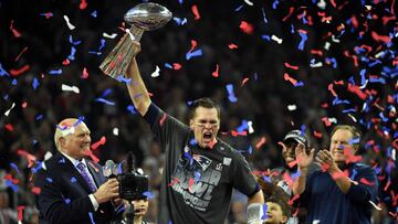 (FILES) This file photo taken on February 5, 2017 shows Tom Brady #12 of the New England Patriots holds the Vince Lombardi Trophy as Head coach Bill Belichick (R) looks on  after defeating the Atlanta Falcons 34-28 in overtime during Super Bowl 51 at NRG Stadium in Houston, Texas.
 A joint probe by the NFL and the NFL Players Association found no evidence Tom Brady suffered a concussion during the 2016 season, a statement said on September 6, 2017. A review of Brady&#039;s medical records by the league and player&#039;s union conducted with the quarterback&#039;s blessing uncovered no sign of concussion.  Brady also did not report or show any symptoms of concussion.The probe was carried out after Brady&#039;s wife, Gisele Bundchen, told CBS television earlier this year that the New England Patriots star had suffered multiple concussions over the years. 
  / AFP PHOTO / Timothy A. CLARY