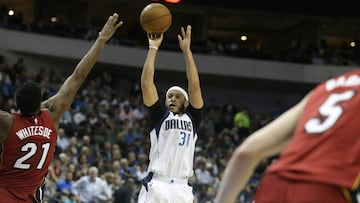 Dallas Mavericks guard Seth Curry (30) shoots against Miami Heat center Hassan Whiteside (21) during the second half of an NBA basketball game in Dallas, Monday, Feb. 27, 2017. The Mavericks won 96-89. (AP Photo/LM Otero)