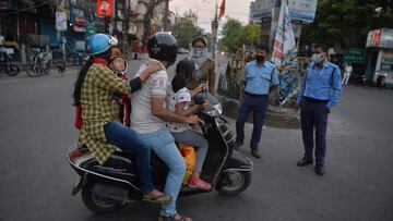 Police personnel inspect people in Siliguri on April 3, 2020. 