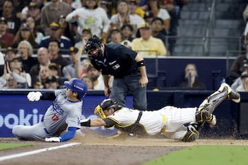 Oct 9, 2024; San Diego, California, USA; San Diego Padres catcher Kyle Higashioka (20) tags out Los Angeles Dodgers designated hitter Shohei Ohtani (17) at home in the fourth inning during game four of the NLDS for the 2024 MLB Playoffs at Petco Park.  Mandatory Credit: David Frerker-Imagn Images