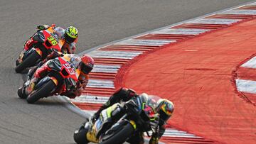 (L-R) Repsol Honda Team's Spanish rider Joan Mir, Repsol Honda's Spanish rider Marc Marquez and Mooney VR46 Racing Team's Italian rider Marco Bezzecchi steer their bikes during a practice session ahead of the Indian MotoGP Grand Prix at the Buddh International Circuit in Greater Noida on the outskirts of New Delhi, on September 22, 2023. (Photo by Money SHARMA / AFP)