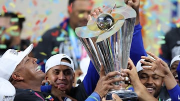 MIAMI, FLORIDA - MARCH 17: Salvador Perez #13 of Team Venezuela lifts the championship trophy after defeating Team United States 3-2 at loanDepot park on March 17, 2026 in Miami, Florida. Al Bello/Getty Images/AFP (Photo by AL BELLO / GETTY IMAGES NORTH AMERICA / Getty Images via AFP)