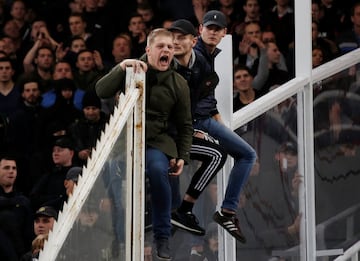 AEK Athens fans jumped onto the pitch and launched flares at the Ajax fans in the Champions League game in Greece on Tuesday night, causing police to intervene.