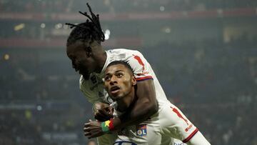 Lyon's Jeff Reine-Adelaide, front, celebrates his goal against Nice during the French League One soccer match between Lyon and Nice, at Groupama stadium in Decines, near Lyon, central France, Saturday, Nov. 23, 2019. (AP Photo/Laurent Cipriani)