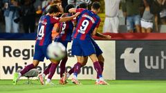 Barcelona's Portuguese defender #02 Joao Cancelo celebrates with teammates after scoring his team's third goal during the Spanish Liga football match between FC Barcelona and RC Celta de Vigo at the  at the Estadi Olimpic Lluis Companys in Barcelona on September 23, 2023. (Photo by Pau BARRENA / AFP)