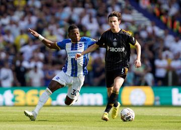 Brighton and Hove Albion's Pervis Estupinan (left) and Leeds United's Brenden Aaronson battle for the ball during the Premier League match at the AMEX Stadium, Brighton. Picture date: Saturday August 27, 2022. (Photo by Gareth Fuller/PA Images via Getty Images)