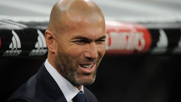 Zinedine Zidane smiles in the Real dugout during the Espanyol match. 