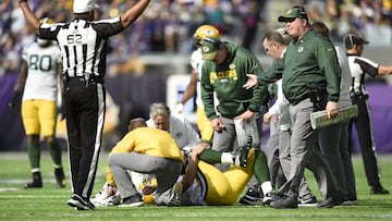 MINNEAPOLIS, MN - OCTOBER 15: Aaron Rodgers #12 of the Green Bay Packers clenches his right knee after being hit during the first quarter of the game against the Minnesota Vikings on October 15, 2017 at US Bank Stadium in Minneapolis, Minnesota.   Hannah Foslien/Getty Images/AFP
 == FOR NEWSPAPERS, INTERNET, TELCOS &amp; TELEVISION USE ONLY ==