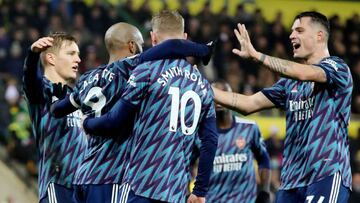 Soccer Football - Premier League - Norwich City v Arsenal - Carrow Road, Norwich, Britain - December 26, 2021 Arsenal's Alexandre Lacazette celebrates scoring their fourth goal with Martin Odegaard, Emile Smith Rowe and Granit Xhaka REUTERS/Chris Rad