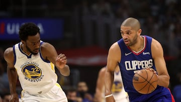 Nicolas Batum #33 of the Los Angeles Clippers steals the ball against Andrew Wiggins #22 of the Golden State Warriors