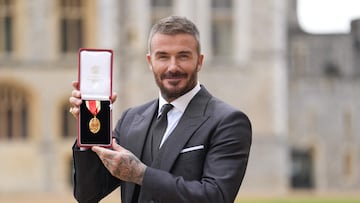 Former England footballer David Beckham poses with their medal after being appointed as a Knight Bachelor (Knighthood) at an investiture ceremony at Windsor Castle on November 4, 2025. (Photo by Andrew Matthews / POOL / AFP)