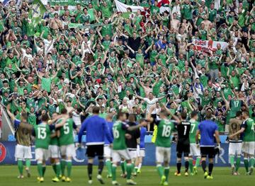 Northern Ireland's supporters celebrate with players, at the end of the Euro 2016 Group C soccer match between Ukraine and Northern Ireland