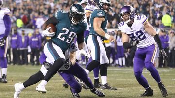 Jan 21, 2018; Philadelphia, PA, USA; Philadelphia Eagles running back LeGarrette Blount (29) carries the ball past Minnesota Vikings strong safety Andrew Sendejo (34) and Vikings free safety Harrison Smith (22) to score a touchdown in the second quarter during the NFC Championship game at Lincoln Financial Field. Mandatory Credit: Geoff Burke-USA TODAY Sports