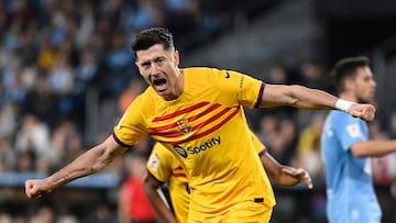 Barcelona's Polish forward #09 Robert Lewandowski celebrates scoring his team's first goal during the Spanish league football match between RC Celta de Vigo and FC Barcelona at the Balaidos stadium in Vigo on February 17, 2024. (Photo by MIGUEL RIOPA / AFP)