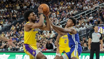 LAS VEGAS, NEVADA - OCTOBER 15: Bronny James #9 of the Los Angeles Lakers drives to the basket against Reece Beekman #3 of the Golden State Warriors in the fourth quarter of their preseason game at T-Mobile Arena at T-Mobile Arena on October 15, 2024 in Las Vegas, Nevada. The Warriors defeated the Lakers 111-97. NOTE TO USER: User expressly acknowledges and agrees that, by downloading and or using this photograph, User is consenting to the terms and conditions of the Getty Images License Agreement. (Photo by Ethan Miller/Getty Images)