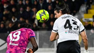 Juventus' Italian forward Moise Kean (L) and Spezia's Greek defender Dimitrios Nikolaou go for a header during the Italian Serie A football match between Spezia and Juventus, on February 19, 2023 at the Alberto-Picco stadium in La Spezia. (Photo by ANDREAS SOLARO / AFP) (Photo by ANDREAS SOLARO/AFP via Getty Images)