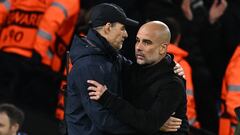 Bayern Munich's German head coach Thomas Tuchel (L) and Manchester City's Spanish manager Pep Guardiola (R) embrace after the UEFA Champions League quarter final, first leg football match between Manchester City and Bayern Munich at the Etihad Stadium in Manchester, north-west England, on April 11, 2023. - Manchester City won the game 3-0. (Photo by Paul ELLIS / AFP)