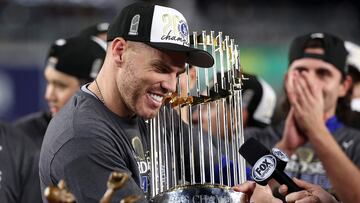 NEW YORK, NEW YORK - OCTOBER 30: Freddie Freeman #5 of the Los Angeles Dodgers celebrates with the trophy after the Dodgers defeated the New York Yankees 7-6 in game 5 to win the 2024 World Series at Yankee Stadium on October 30, 2024 in the Bronx borough of New York City. Elsa/Getty Images/AFP (Photo by ELSA / GETTY IMAGES NORTH AMERICA / Getty Images via AFP)