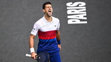 Serbia&#039;s Novak Djokovic reacts as he plays against Russia&#039;s Daniil Medvedev during their men&#039;s single final tennis match on the last day of the ATP Paris Masters at The AccorHotels Arena in Paris on November 7, 2021. (Photo by Anne-Christine POUJOULAT / AFP)