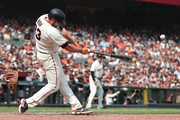 Sep 2, 2021; San Francisco, California, USA; San Francisco Giants first baseman Darin Ruf (33) hits an rbi double during the eighth inning against the Milwaukee Brewers at Oracle Park. Mandatory Credit: Sergio Estrada-USA TODAY Sports