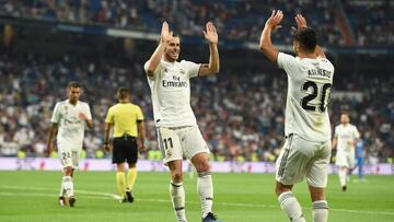 MADRID, SPAIN - AUGUST 19: Gareth Bale of Real Madrid celebrates with Marco Asensio after scoring his teams second goal during the La Liga match between Real Madrid CF and Getafe CF at Estadio Santiago Bernabeu on August 19, 2018 in Madrid, Spain. (Photo
