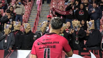 Tijuana's Chilean defender #04 Nicolas Diaz reacts at Tijuana's fans protesting the team's performance and covering their heads with paper bags at the end of the Mexican Clausura tournament football match between Tijuana and Monterrey at Caliente stadium in Tijuana, Baja California state, Mexico, on February 28, 2024. (Photo by Guillermo Arias / AFP)