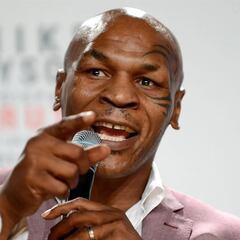 When was Mike Tyson’s last fight? What’s his record and how many knockout wins does he have?