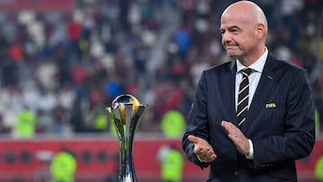 FIFA President Gianni Infantino stands with the winner&#039;s trophy during the 2019 FIFA Club World Cup Final football match between England&#039;s Liverpool and Brazil&#039;s Flamengo at the Khalifa International Stadium in the Qatari capital Doha on De