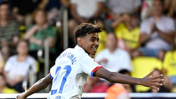 Barcelona's Spanish forward #27 Lamine Yamal celebrates after Barcelona's Polish forward #09 Robert Lewandowski (not seen) scored during the Spanish Liga football match between Villarreal CF and FC Barcelona at La Ceramica stadium in Vila-real on August 27, 2023. (Photo by JAVIER SORIANO / AFP)