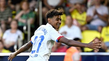 Barcelona's Spanish forward #27 Lamine Yamal celebrates after Barcelona's Polish forward #09 Robert Lewandowski (not seen) scored during the Spanish Liga football match between Villarreal CF and FC Barcelona at La Ceramica stadium in Vila-real on August 27, 2023. (Photo by JAVIER SORIANO / AFP)