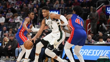 Jan 23, 2023; Detroit, Michigan, USA; Milwaukee Bucks forward Giannis Antetokounmpo (34) drives between Detroit Pistons guard Jaden Ivy (23) (left) and forward Sadie Bey (41) in the third quarter at Little Caesars Arena. Mandatory Credit: Lon Horwedel-USA TODAY Sports