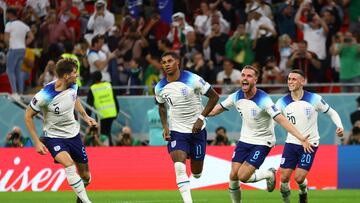 Soccer Football - FIFA World Cup Qatar 2022 - Group B - Wales v England - Ahmad Bin Ali Stadium, Al Rayyan, Qatar - November 29, 2022 England's Marcus Rashford celebrates scoring their first goal with John Stones, Jordan Henderson and Phil Foden REUTERS/Hannah Mckay