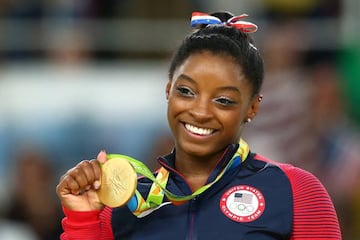 Biles celebrates on the podium at the medal ceremony for the Women's Floor on Day 11 of the Rio 2016 Olympic Games.