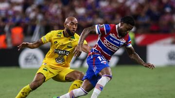 Bucaramanga's midfielder #08 Fredy Hinestroza (L) and Fortaleza's forward #11 Marinho fight for the ball during the Copa Libertadores group stage football match between Brazil's Fortaleza and Colombia's Atletico Bucaramanga, at the Arena Castelao stadium in Fortaleza, state of Ceara, Brazil, on May 13, 2025. (Photo by Thiago GADELHA / AFP) (Photo by THIAGO GADELHA/AFP via Getty Images)