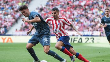 Miguel Gutierrez of Griona FC (L) is chased by Angel Correa of Atletico de Madrid (R) during a match between Atletico de Madrid v Girona FC as part of LaLiga in Madrid, Spain, on October 8, 2022. (Photo by Alvaro Medranda/NurPhoto via Getty Images)