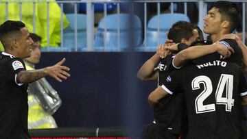 Sevilla's Argentinian midfielder Joaquin Correa (R) celebrates a goal with teammates during the Spanish league football match Malaga CF against Sevilla FC at La Rosaleda stadium in Malaga on February 28, 2018. / AFP PHOTO / JORGE GUERRERO