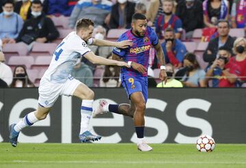 Memphis Depay y Tomasz Kedziora
