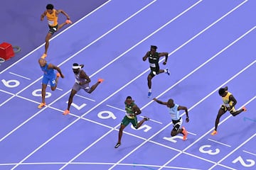 Nine lanes | South Africa's Akani Simbine (5) crosses the finish line ahead of Botswana's Letsile Tebogo (4), Italy's Lamont Marcell Jacobs (8), US' Kenneth Bednarek (7), Jamaica's Ackeem Blake (3), Nigeria's Kayinsola Ajayi (6) and Germany's Joshua Hartmann (9) in the men's 100m semi-final.