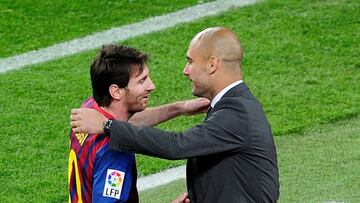 (FILES) In this file photo taken on May 5, 2012 Barcelona's Argentinian forward Lionel Messi (L) celebrates with Barcelona's coach Josep Guardiola after scoring during the Spanish league football match FC Barcelona vs RCD Espanyol at the Camp No