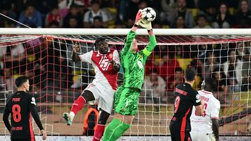 Barcelona's German goalkeeper #01 Marc-Andre Ter Stegen (R) makes a save during the UEFA Champions League 1st round day 1 football match between AS Monaco and FC Barcelona at the Louis II Stadium in the Principality of Monaco on September 19, 2024. (Photo by Miguel MEDINA / AFP)
